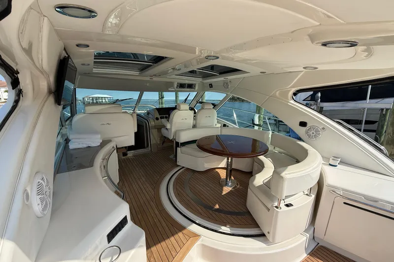 Slide: The Image of Luxurious 2008 Sea Ray 550 Sundancer yacht interior with elegant seating and wooden flooring. - 5