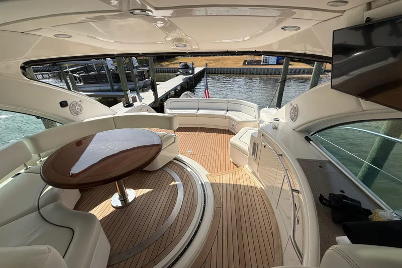 Slide: The Image of Luxurious 2008 Sea Ray 550 Sundancer yacht interior with elegant seating and wooden flooring. - 6