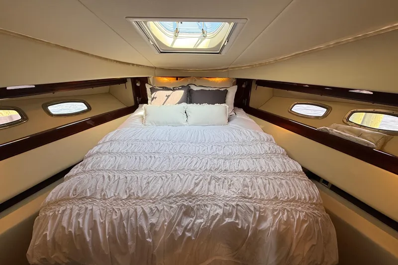 Slide: The Image of Luxurious bedroom interior of 2008 Sea Ray 550 Sundancer yacht with elegant bedding. - 7