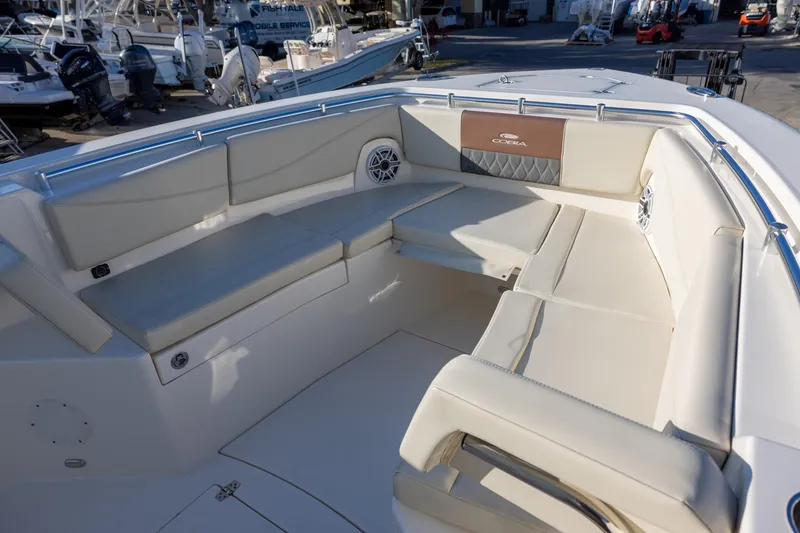 Slide: The Image of 2022 Cobia 320 Center Console boat with spacious seating area and modern design. - 24
