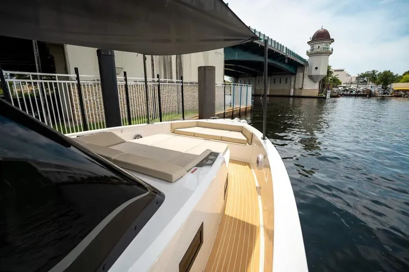 Slide: The Image of De Antonio Yachts D42 2026 under bridge, luxurious deck design. - 16