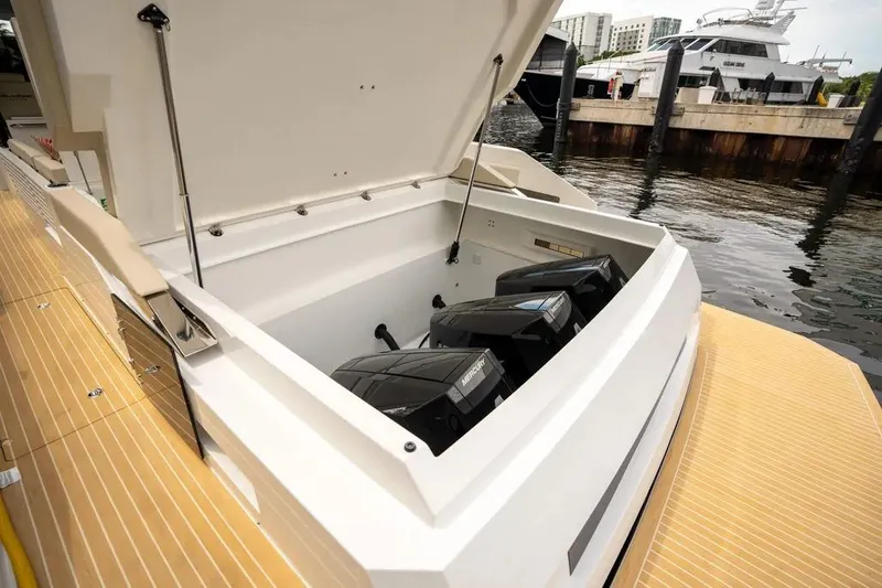 Slide: The Image of De Antonio Yachts D42 2026 with open engine compartment at dock. - 5
