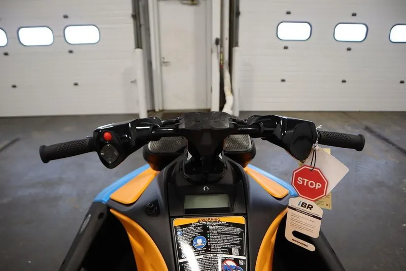 Slide: The Image of Handlebars of a 2025 Sea-Doo Spark Trixx with stop tag. - 11