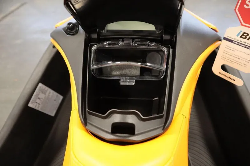 Slide: The Image of 2025 Sea-Doo Spark Trixx storage compartment with open lid. - 12