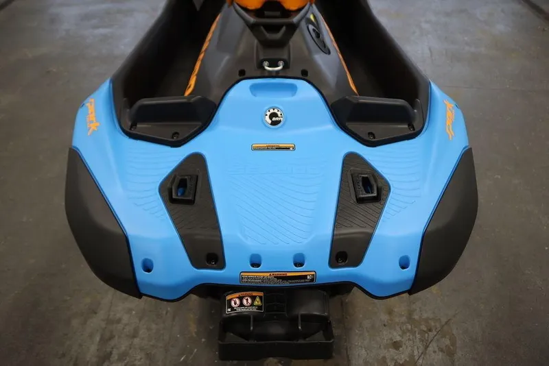 Slide: The Image of 2025 Sea-Doo Spark Trixx jet ski, blue and black design. - 16