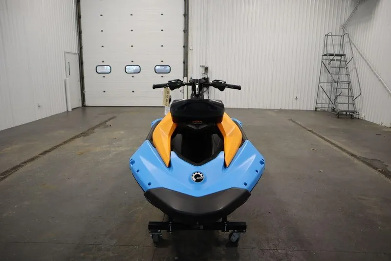 Slide: The Image of 2025 Sea-Doo Spark Trixx in warehouse, front view. - 2