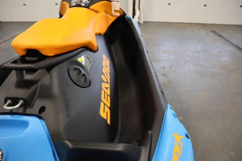 Slide: The Image of 2025 Sea-Doo Spark Trixx, orange and blue, close-up view. - 20