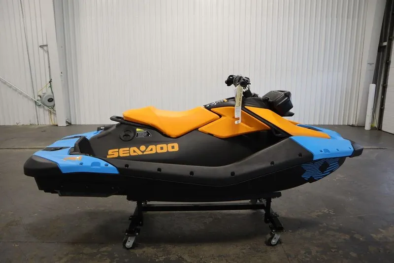 Slide: The Image of 2025 Sea-Doo Spark Trixx jet ski in a warehouse. - 3