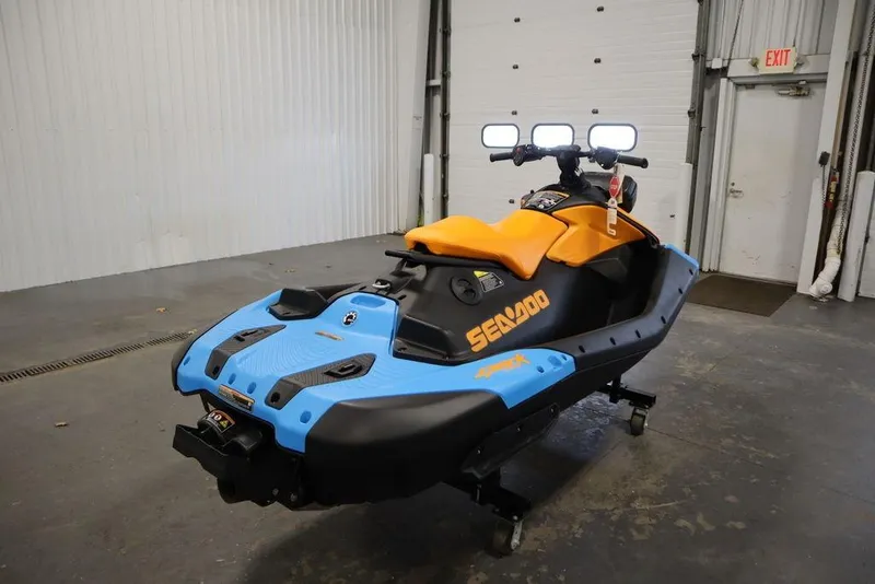 Slide: The Image of 2025 Sea-Doo Spark Trixx jet ski in warehouse. - 4