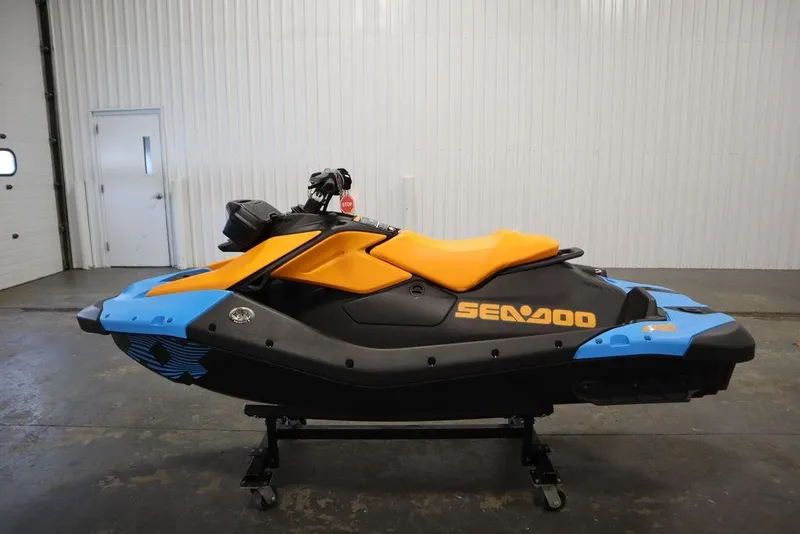 Slide: The Image of 2025 Sea-Doo Spark Trixx jet ski in a garage. - 6