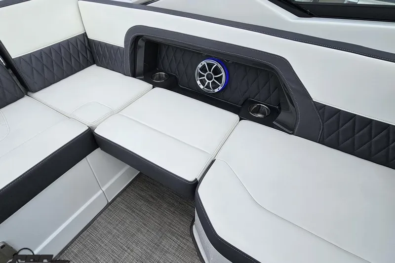 Slide: The Image of Luxurious interior seating of 2017 Monterey 298SS Super Sport boat with speaker and cup holders. - 113