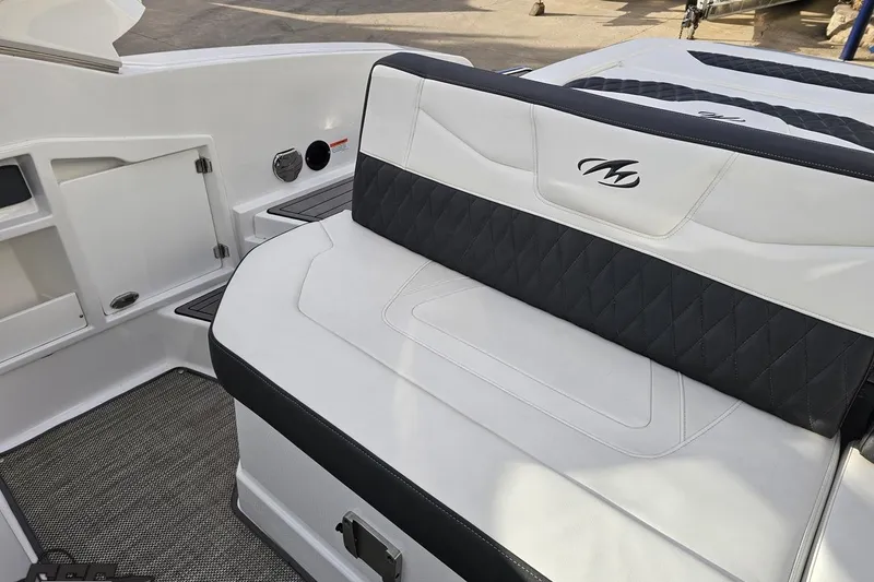 Slide: The Image of 2017 Monterey 298SS Super Sport boat interior with white and black seating. - 115