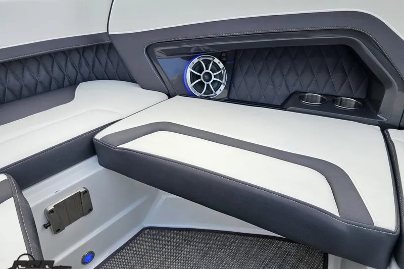 Slide: The Image of 2017 Monterey 298SS Super Sport boat interior with cushioned seating and speaker system. - 94