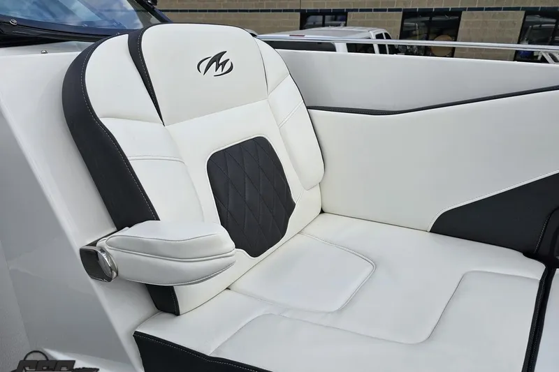 Slide: The Image of Luxurious seating in a 2017 Monterey 298SS Super Sport boat, featuring elegant black and white upholstery. - 96