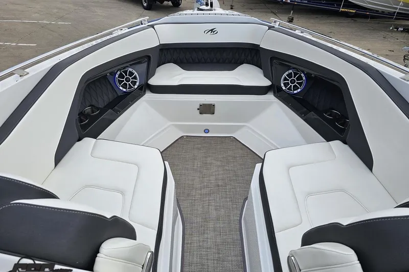 Slide: The Image of 2017 Monterey 298SS Super Sport boat interior with white seating and speakers. - 97
