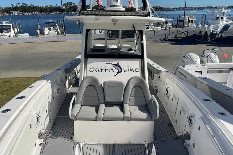 Slide: The Image of 2013 Everglades 355 Center Console boat docked by the waterfront. - 4