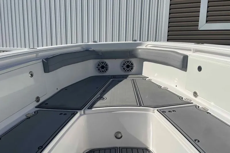 Slide: The Image of 2013 Everglades 355 Center Console boat interior with seating and speakers. - 7