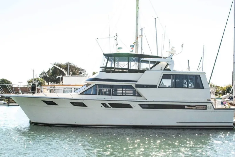 The Image of 1987 Californian 53 Cockpit Motor Yacht on calm water, side view. - 0