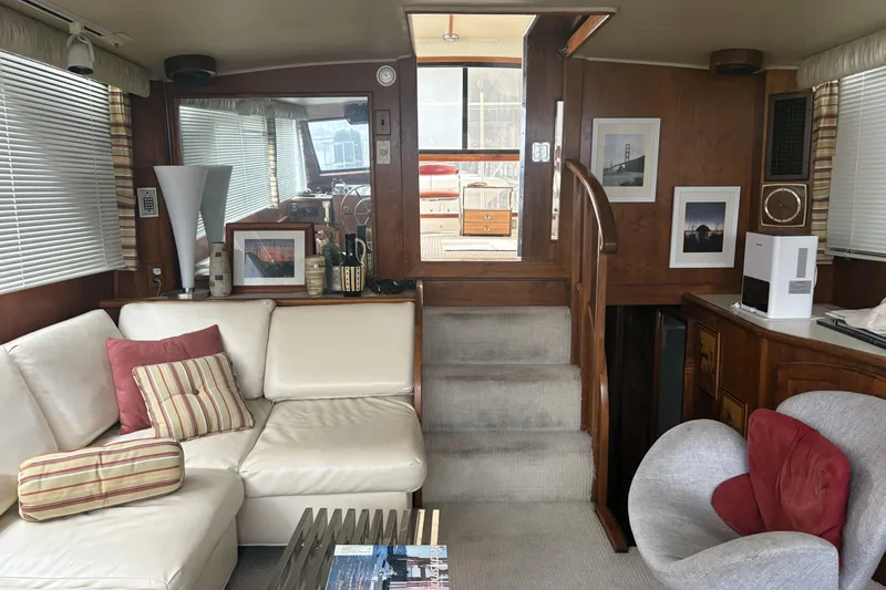 Slide: The Image of Interior of 1987 Californian 53 Cockpit Motor Yacht with cozy seating and decor. - 3