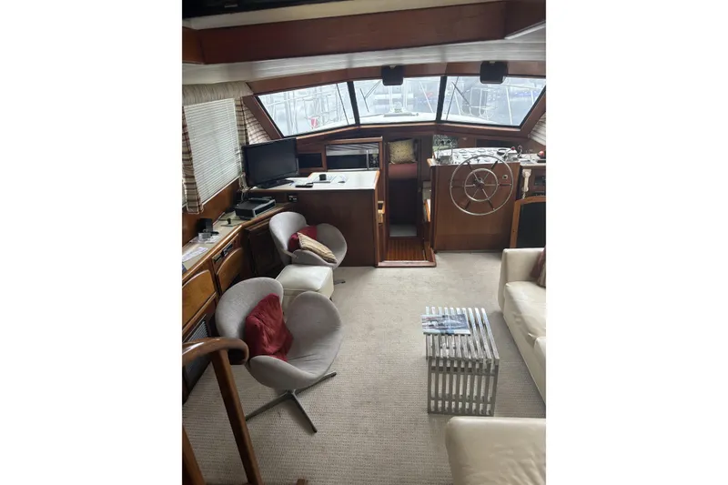Slide: The Image of Interior of 1987 Californian 53 Cockpit Motor Yacht with helm, seating, and windows. - 4