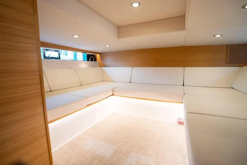 Slide: The Image of Interior of De Antonio Yachts D42, 2026, featuring sleek white upholstery. - 24