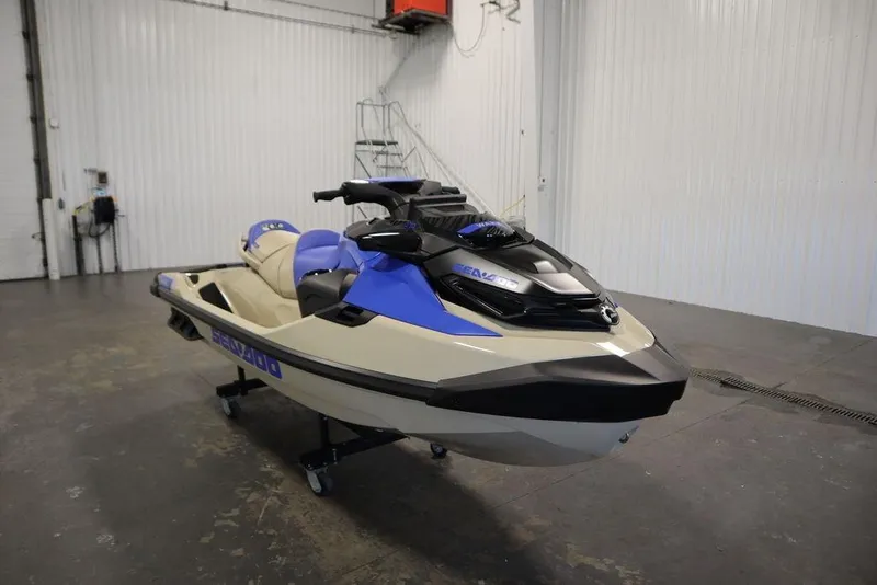 Slide: The Image of 2025 Sea-Doo Wake Pro 230 jet ski in a garage setting. - 2