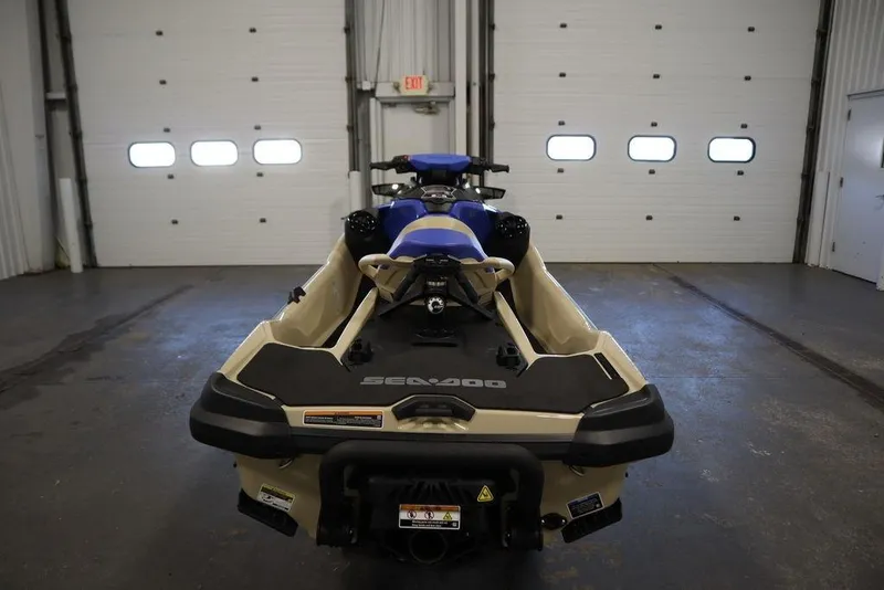 Slide: The Image of 2025 Sea-Doo Wake Pro 230 jet ski in a garage, rear view. - 4