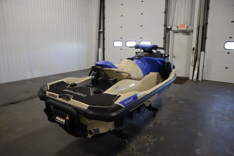 Slide: The Image of 2025 Sea-Doo Wake Pro 230 jet ski in a garage setting. - 8