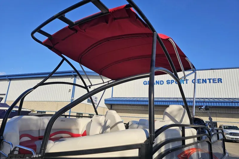 Slide: The Image of 2019 JC Tritoon Neptoon 25 Sport SL with red canopy at Grand Sport Center. - 11