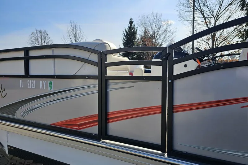 Slide: The Image of 2019 JC Tritoon Neptoon 25 Sport SL pontoon boat with sleek design and vibrant accents. - 30