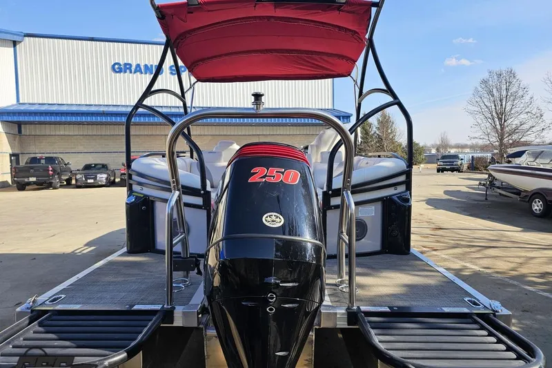 Slide: The Image of 2019 JC Tritoon Neptoon 25 Sport SL with powerful 250 engine, parked outdoors. - 39