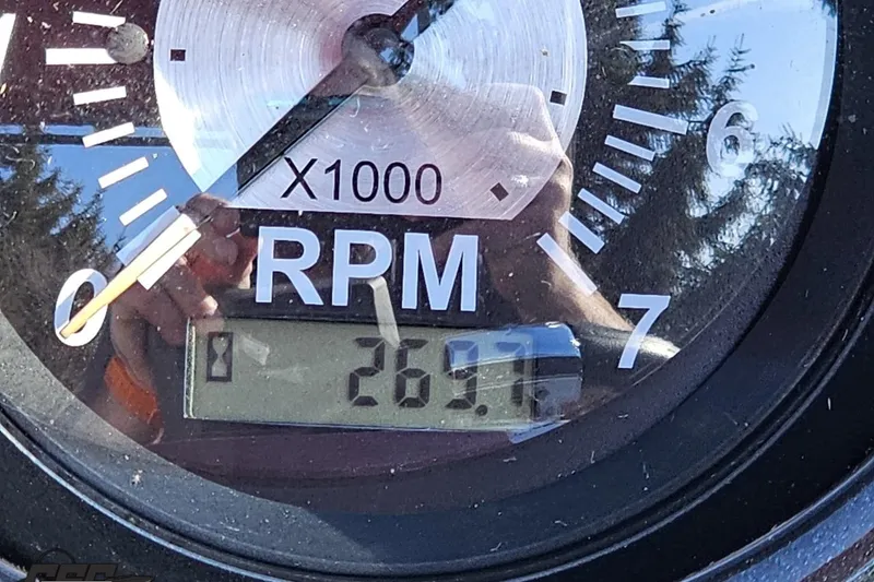 Slide: The Image of Close-up of JC Tritoon Neptoon 25 Sport SL 2019 RPM gauge showing 2670 RPM. - 58