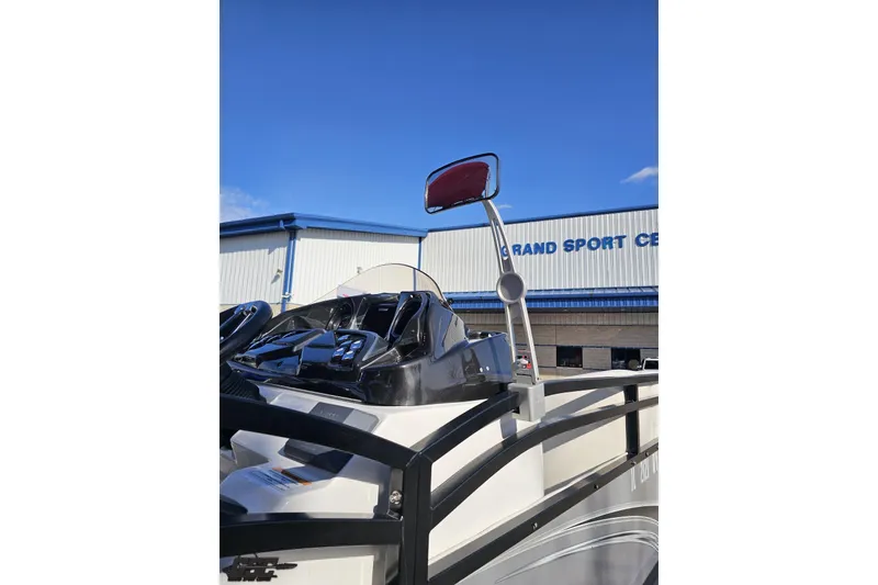 Slide: The Image of 2019 JC Tritoon Neptoon 25 Sport SL at dealership, showcasing sleek design and controls. - 6