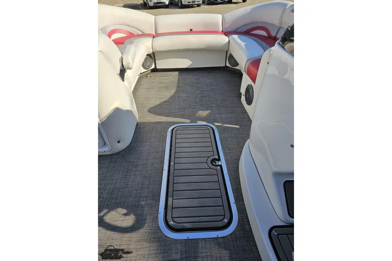 Slide: The Image of 2019 JC Tritoon Neptoon 25 Sport SL interior with seating and deck hatch. - 65