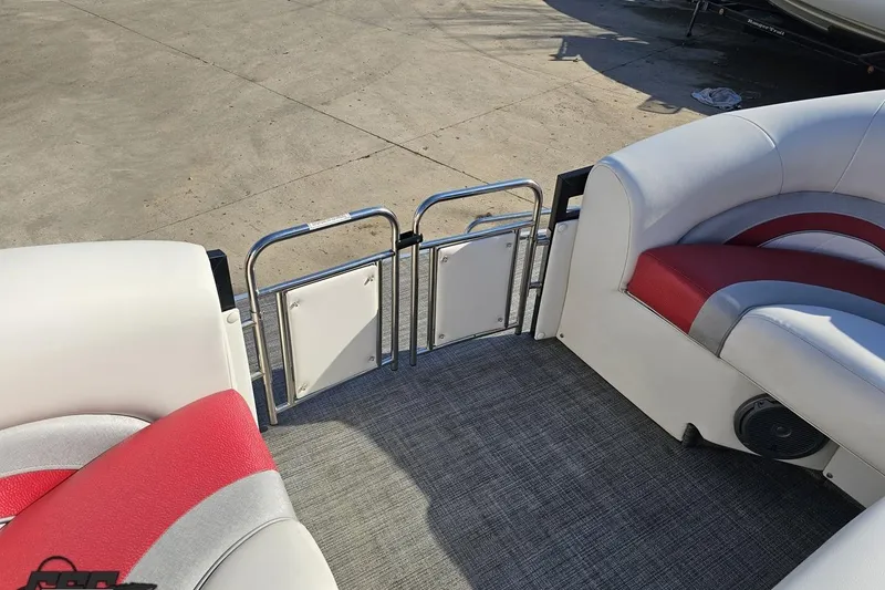 Slide: The Image of 2019 JC Tritoon Neptoon 25 Sport SL interior with red and white seating, open gate. - 72