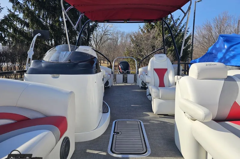 Slide: The Image of 2019 JC Tritoon Neptoon 25 Sport SL interior with red accents and canopy. - 76