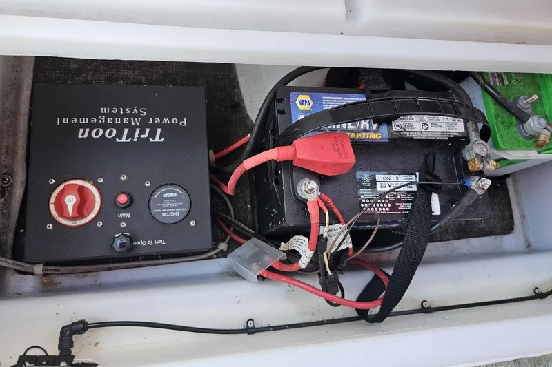 Slide: The Image of Power management system and battery setup in 2019 JC Tritoon Neptoon 25 Sport SL boat. - 88