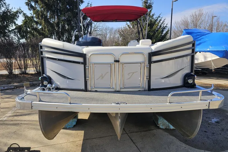 Slide: The Image of 2019 JC Tritoon Neptoon 25 Sport SL pontoon boat with red canopy, docked outdoors. - 15