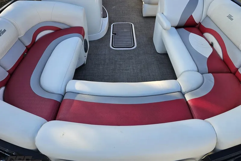Slide: The Image of Luxurious seating on 2019 JC Tritoon Neptoon 25 Sport SL with red and white upholstery. - 18