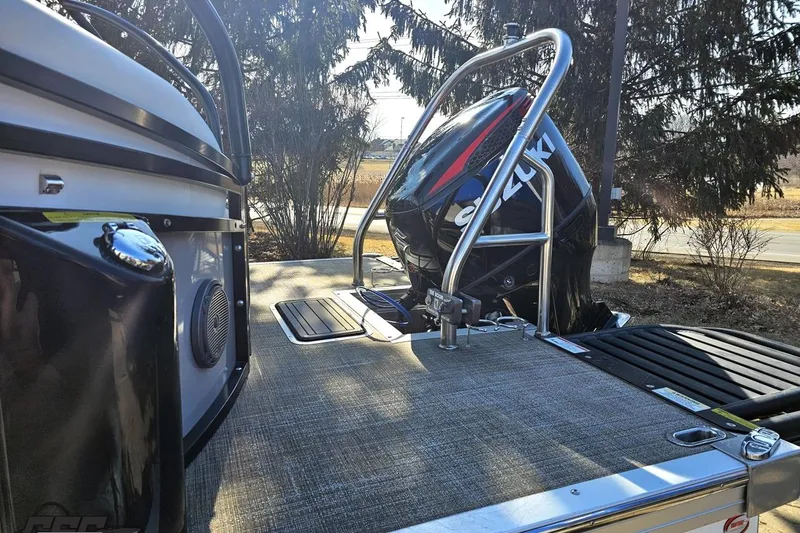Slide: The Image of 2019 JC Tritoon Neptoon 25 Sport SL with Suzuki outboard motor, docked outdoors. - 33