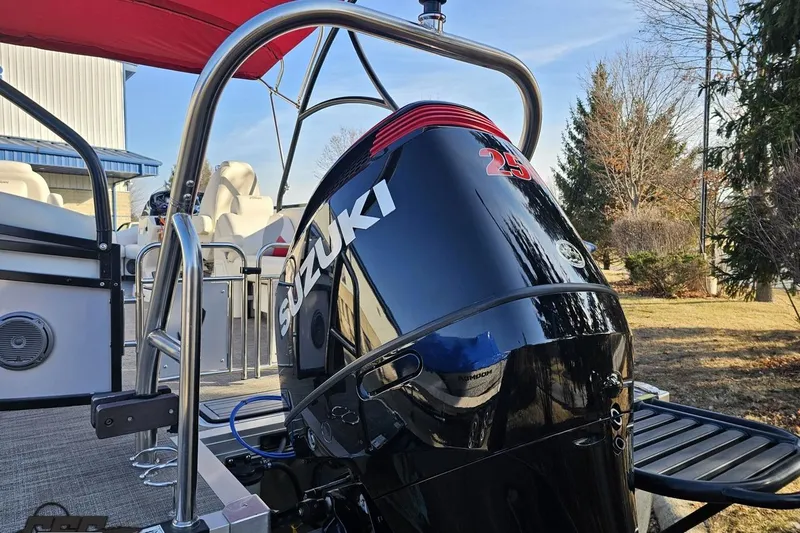 Slide: The Image of 2019 JC Tritoon Neptoon 25 Sport SL with Suzuki outboard motor, red canopy, and sleek design. - 37