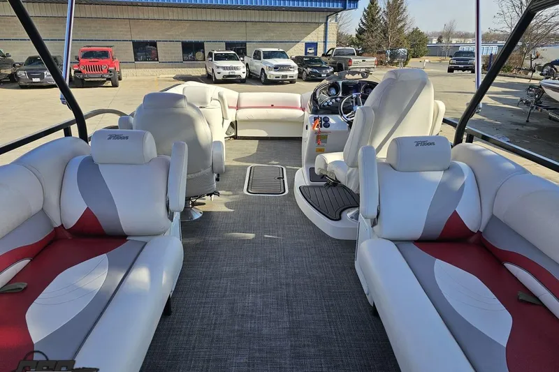 Slide: The Image of 2019 JC Tritoon Neptoon 25 Sport SL interior with plush seating and modern dashboard. - 48