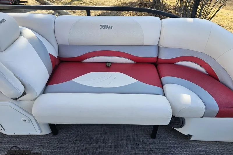 Slide: The Image of 2019 JC Tritoon Neptoon 25 Sport SL boat seating with red, white, and gray upholstery. - 50