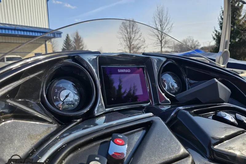 Slide: The Image of 2019 JC Tritoon Neptoon 25 Sport SL dashboard with Simrad display and RPM gauge. - 57