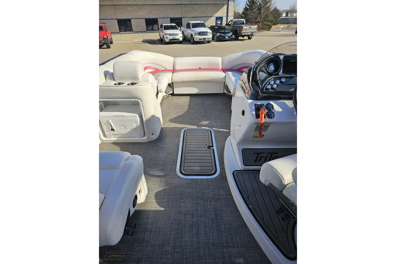 Slide: The Image of Interior of 2019 JC Tritoon Neptoon 25 Sport SL with plush seating and modern dashboard. - 60