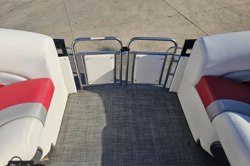 Slide: The Image of 2019 JC Tritoon Neptoon 25 Sport SL interior with red and white seating, open gate. - 71