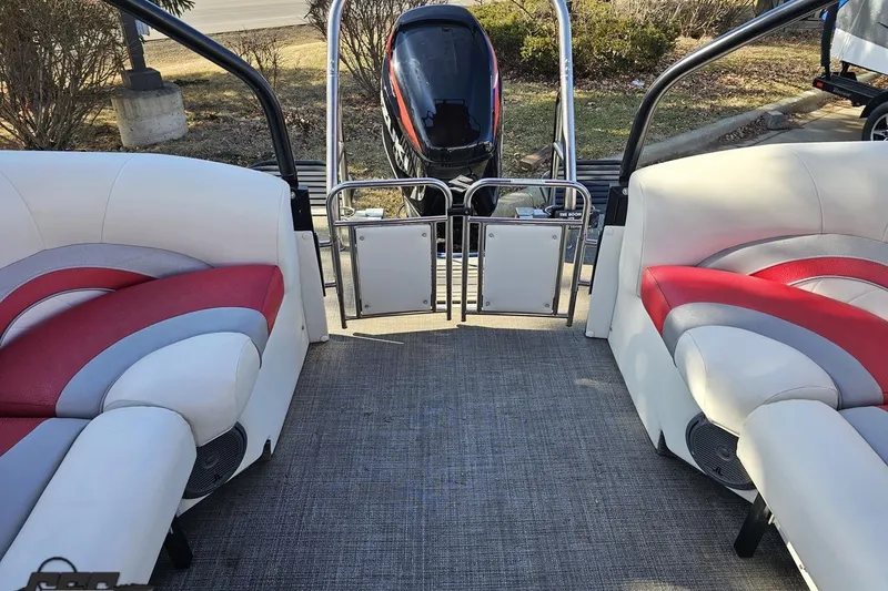 Slide: The Image of 2019 JC Tritoon Neptoon 25 Sport SL interior with red and white seating, rear view. - 85