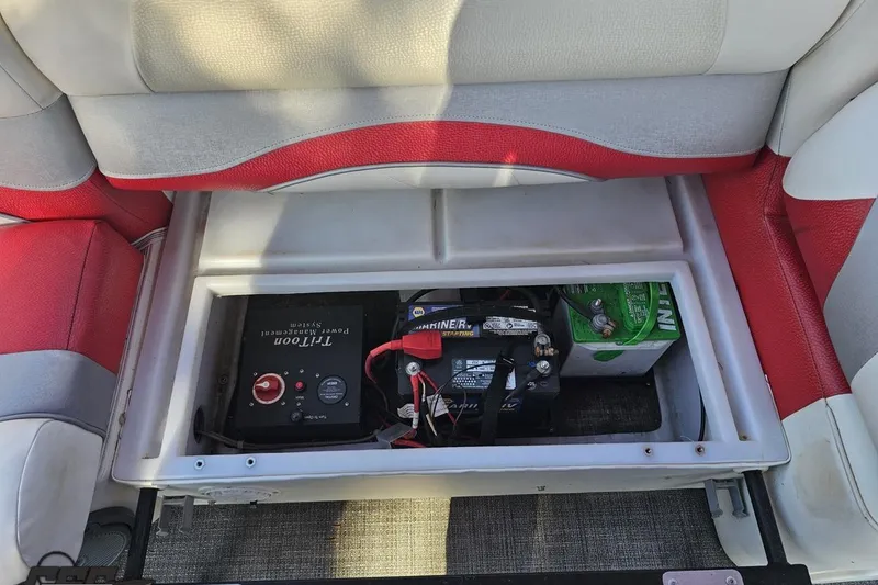 Slide: The Image of 2019 JC Tritoon Neptoon 25 Sport SL battery compartment with power management system. - 87