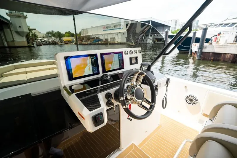 Slide: The Image of 2026 De Antonio Yachts D42 cockpit with modern navigation displays. - 14