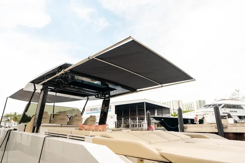 Slide: The Image of De Antonio Yachts D42 2026 with sunshade at dock. - 8